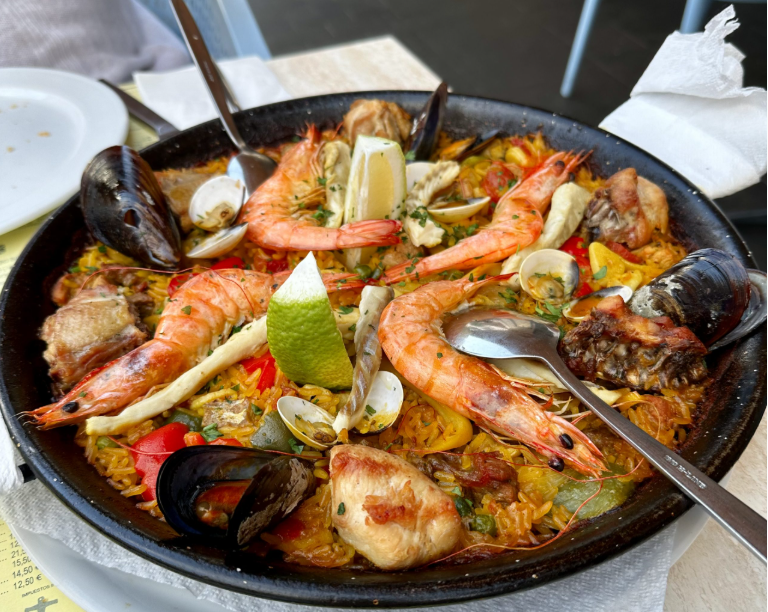 Authentic Spanish seafood paella with prawns, mussels, clams and lemon served at a Costa Teguise restaurant in Lanzarote